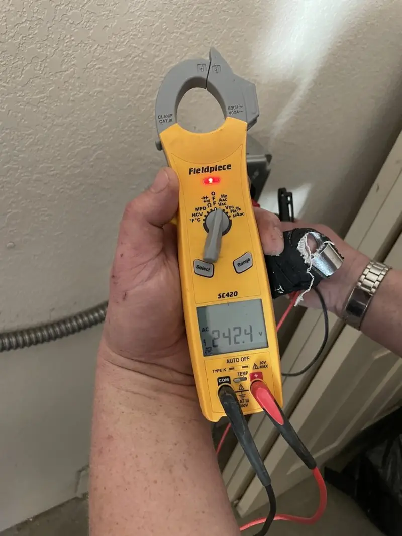 Voltage testing with clamp meter during Circuit Breaker Repair in Milton